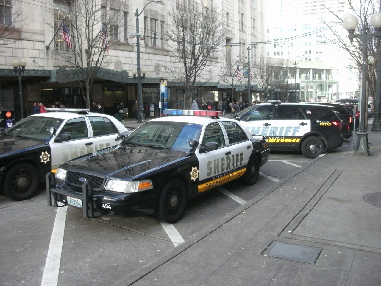 Seattle’s Stay Out Orders and Encampment Sweeps Continue Trend toward Criminalization Several sheriff vehicles park on Pine Street in Downtown Seattle next to the light rail station.