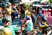 Subscriber Drive: Local Leaders Share Why They Support The Urbanist Mayor Mike McGinn cutting the ribbon on the Ballard Neighborhood Greenway as kids on bikes line up to get a first ride. (Credit: Dennis Bratland)