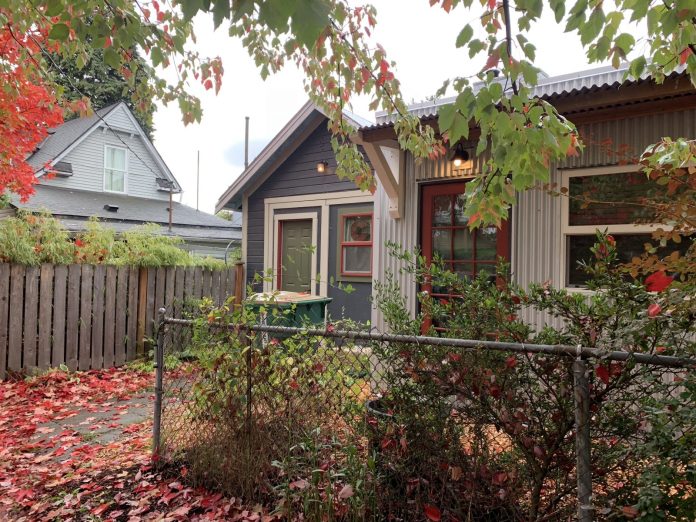 Backyard cottage A cottage in a leafy backyard in the fall.