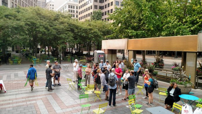 A few dozen people gather at Westlake Park for The Urbanist's Center City walking tour.