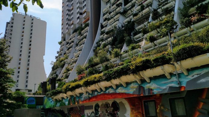 Wohnpark Alterlaa Housing Complex Vienna social housing towers with greenery hanging from balconies.
