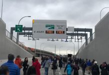 Seattle Squeeze 2.0? SR-99 Tolling Could Divert Traffic to City Streets The entrance portal to the new SR-99 tunnel was filled with pedestrians during a special event before the grand opening.