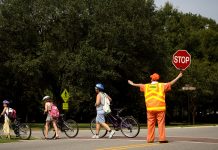 Council Takes Initial Steps to Fix Childcare in Seattle School crossing guards are a low paid, but essential position. Seattle Public Schools has struggled to recruit and train school crossing guards in recent years. (Credit: Nicholas Pilch)
