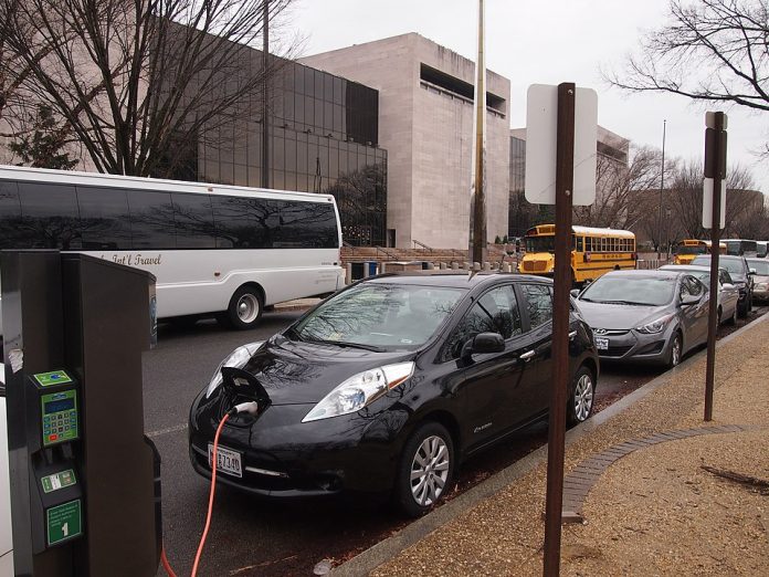 Electric Car Charging by Slowking4 An electric car charging outside a museum. (Credit: Slowking4, Wikimedia Commons)