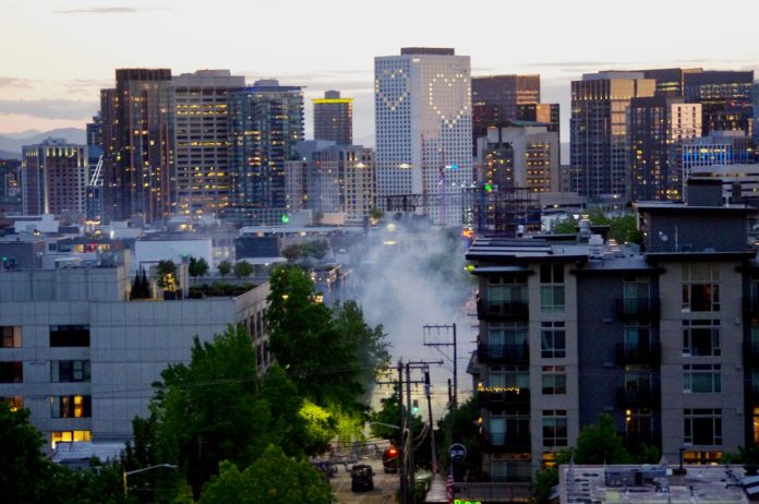 Tear gas on Monday - Ethan Campbell Tear gas rises near the East Precinct building on E. Pine St. on Monday, May 1, as police disperse a crowd of protestors. (Photo by Ethan Campbell)