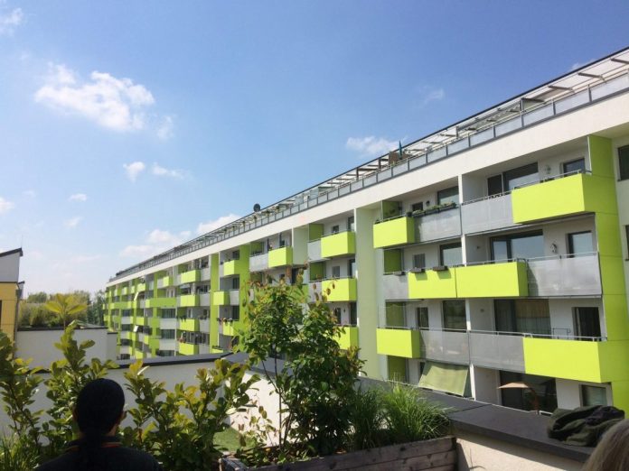 passivhaus-foto-by-Mike-Eliason-e1570823349709 A large lime green seven-story apartment building in Vienna. (Photo by Mike Eliason)