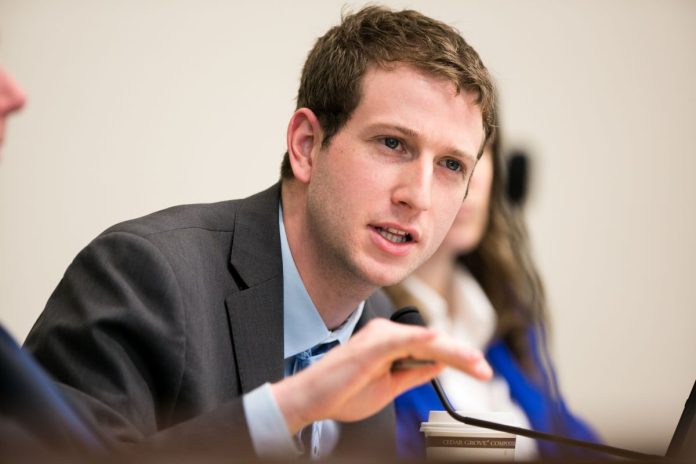 Fitzgibbon Picture of Joe Fitzgibbon making a hand gesture at a hearing. (Credit: Washington State Legislature)