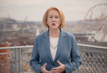 Mayor’s Budget Proposes Adding 35 Cops, Skimps Elsewhere Mayor Durkan with Ferris wheel and Seattle waterfront in background