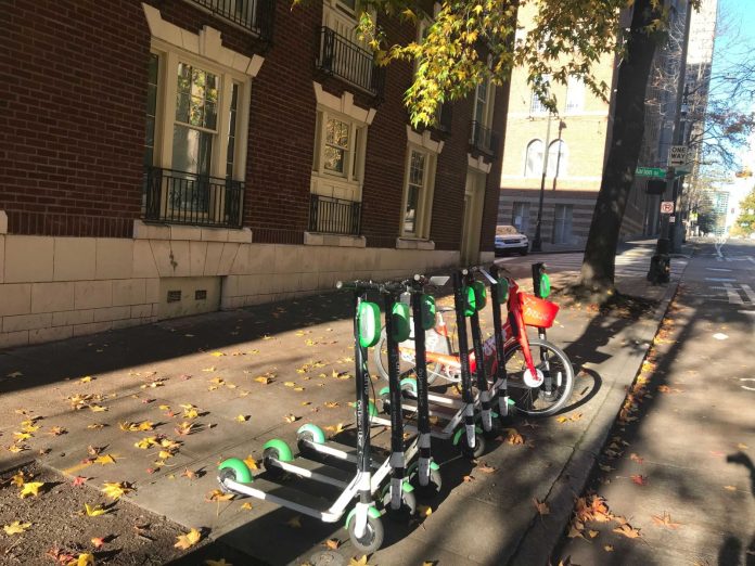 Lime scooters on street by Stephen Fesler
