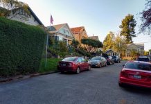 Seattle Desperately Needs the GMA to Promote Affordable Housing A street with a row of single family homes with one under construction.