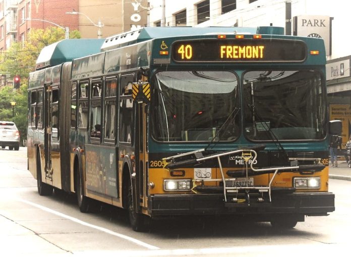 Route 40 A green and yellow Route 40 with Fremont displayed on its screen with downtown towers in background.