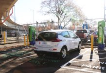 City Light Plans Electric Car Charging Lot in the Heart of Ballard A white SUV next to a charging port.