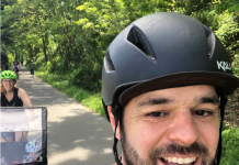 Testimonial: Why Our Family Supports The Urbanist Tom taking a selfie biking on a trail with Kelli and the kid in tow