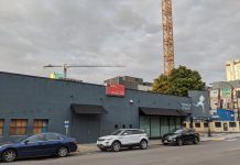 Harrell Hopes to Fill Downtown Storefronts by Easing Code Restrictions Serious Pie and Biscuit is shuttered. Construction cranes tower in the background.