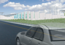 Freeway Ramp at Overlake Village Station Repeats Past Mistakes A drawing shows a translucent car driving on a highway with a light rail station on the right side of the road.