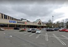 The Urbanist Podcast: Lots of Housing Going Up Above Seattle Safeway Grocery Stores A photo of a low-rise grocery store with a surface level parking lot in front of it.