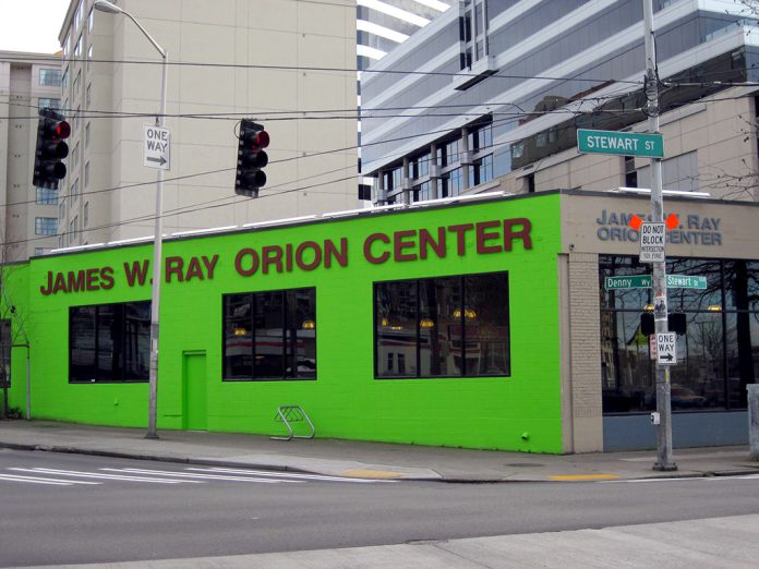 Orion-Center-Seattle-January-26-2010-Courtesy-Blanket-America A photo of a bright green building with the words James W Ray Orion Center written on it.