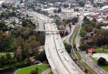 The Urbanist Podcast: How the Cold War Suburbanized America A photo of a wide highway in a suburban landscape.