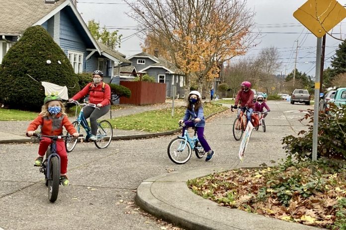 Kids biking in a Seattle roundabout