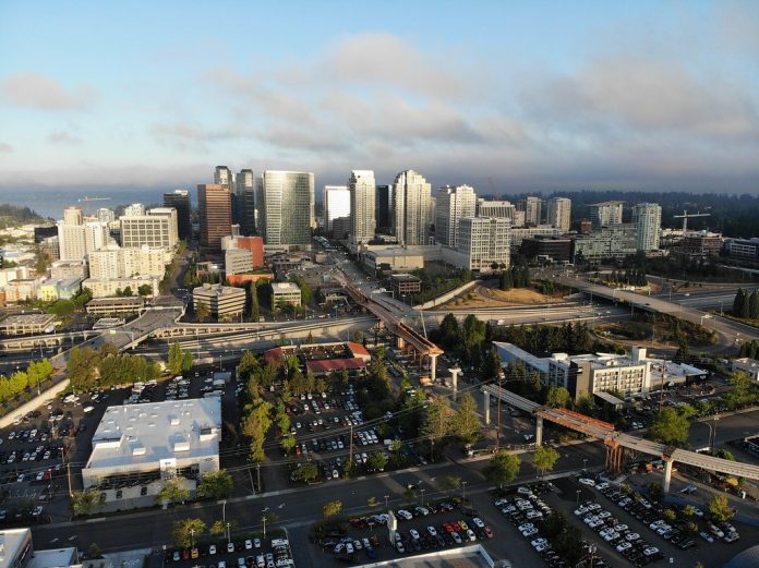 45255752605_c9cc64e8bf_b A photo of a city with light rail under construction, streets, and tall modern buildings in the distance