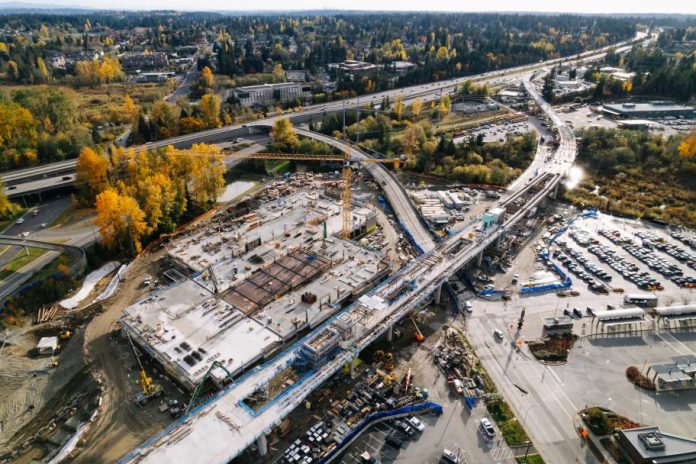 Lynnwood Link construction_20211108-2 sound transit Trees have their fall colors near the track pulling into Downtown Lynnwood Station.
