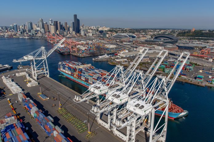The downtown Seattle skyline behind the Port of Seattle's facility at T5