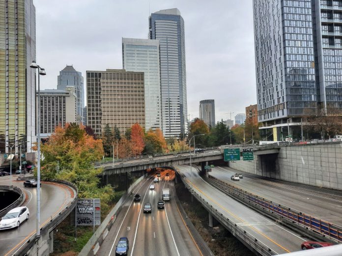 I-5 in Downtown Seattle nov2021 I-t trench with skyscapers and overpasses in the background.