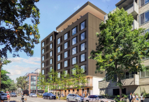 Housing Notes: 413 Apartments Proposed in Bitter Lake, Everett Waterfront Development, Bel-Red Rising A rendering of an apartment building on a business street with trees