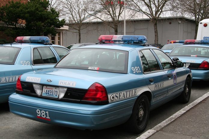 Seattle_Police_car_981 A light blue SPD police cruiser in a parking lot.
