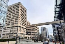 Seattle’s Rushed Plan to Jail Low-Level Offenders Passes Its First Hurdle The view down 5th Avenue S with the King County Jail and skyway passage.