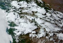 Climate Change is Influencing Seattle’s Unusual Spring Heatwave Satellite photo of the Pacific Northwest with cloud cover on May 15, 2023