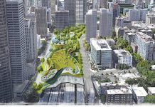 Seattle City Council Supports Lidding I-5 in New Resolution Aerial view of downtown buildings with rendering of a park lid over the highway.