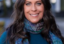 Maren Costa Builds Council Run on West Seattle Roots and Climate Organizing Maren is smiling and wearing a blue scarf.
