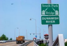 South Park Organizes To Tackle Highway Pollution Dumptruck crossing the Duwamish River Highway overpass.