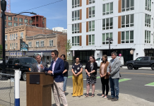 Spokane Leads the Way with Parking Reform Spokane Council Member Zack Zappone and others in front of a new Spokane apartment building.