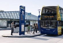 Sound Transit Selects Private Bus Operator for Stride BRT Network A double decker bus is rendered in Stride livery sitting at a bus station.