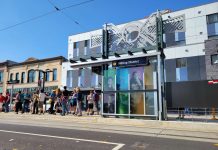 Becoming a ’15-Minute City’ Could Be Within Reach for Tacoma Sunny opening day of the T-Line with people waiting for a streetcar to arrive.