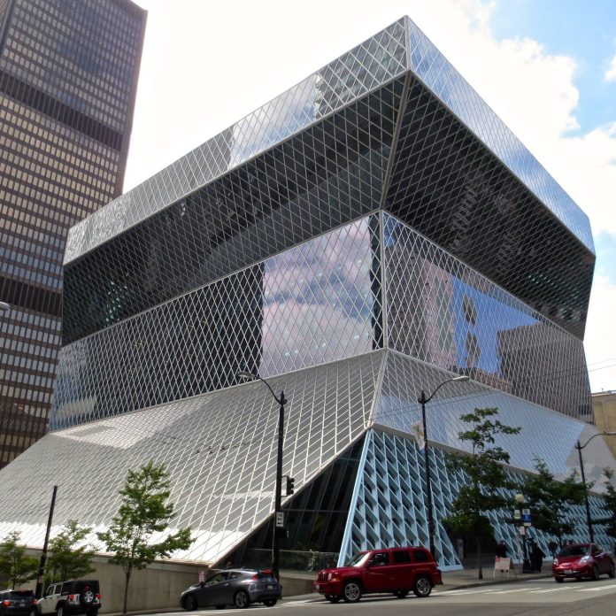 Seattle Central Library 2014 LSH Seattle Central Library is a glassy modernist building that cantilever out at the top.