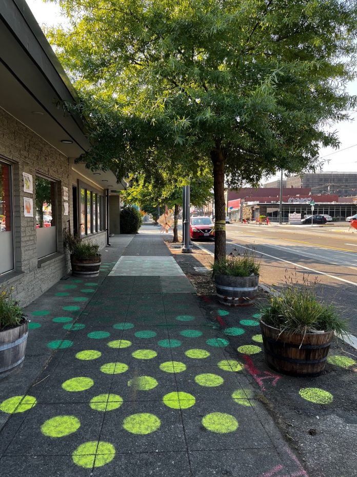 Tree shade cools paved surfaces Green street trees shade Tacoma sidewalks. Colored dots on the sidewalk represent the values of the cooling effect.