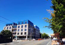 Harrell Delays Comprehensive Plan Release Again, Likely to 2024 A five-story mixed-use brick building under construction on Phinney Avenue.