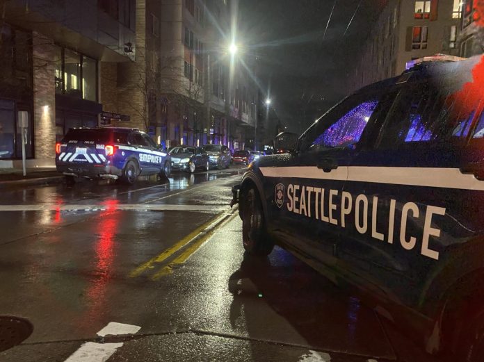 Two SPD squad cars at a response scene