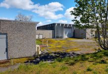 Fort Lawton Housing Project Faces a Make-or-Break Moment Fort Lawton include patchy grass and drab concrete low slung buildings and garages that used to serve the military installation.