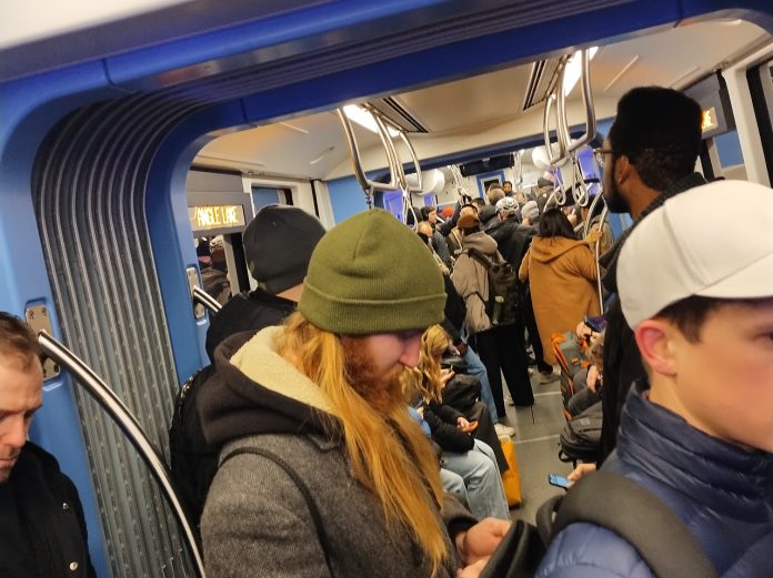 Passengers on a packed Link train