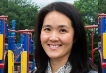 Op-Ed: Seattle Needs Another Pro-Housing Advocate on Council Song poses in front a playground jungle gym.