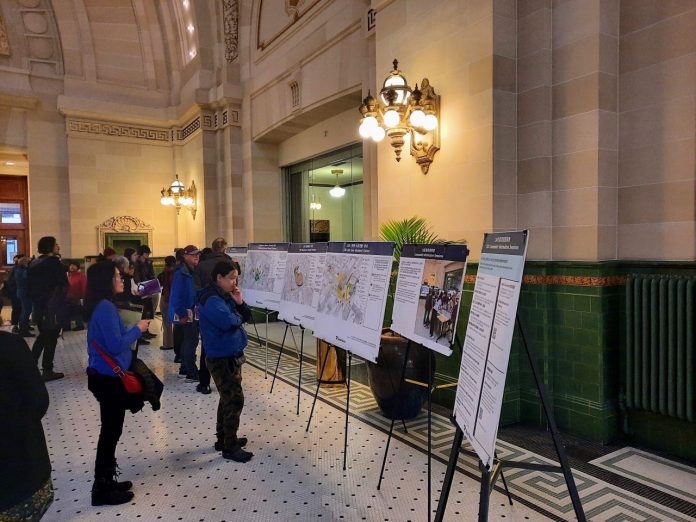 Attendees-Ponder-Displays-at-Union-Station-Hub-Event-20240228
