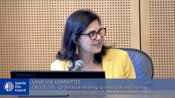 Morales at Land Use Committee 2024-04-19 Seattle Channel Morales wears a yellow blazer and glasses.