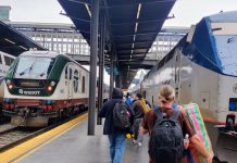 Amtrak Shelves 70 Aging ‘Horizon’ Traincars, Upending Cascades Service Indefinitely Passengers lug their suitcases toward the train under an awning