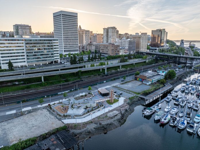 Marina LaPlant_Dressel_Park_5-15-24-4 by Mitchell Paine An aerial photo shows Tacoma's waterfront separated from its downtown towers by its elevated I-705 freeway.