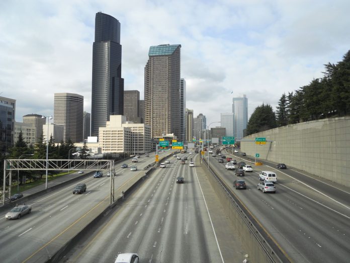 I-5 in downtown Seattle via LidI5 dscn5194 1600 The Seattle skyline rises above the I-5 freeway trench in South Downtown.