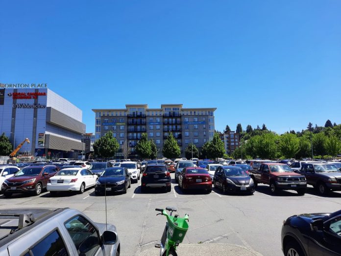 Northgate Transit Center parking lot - Trumm 20240607 A parking lot on a hot day in Northgate, with Thornton Place behind
